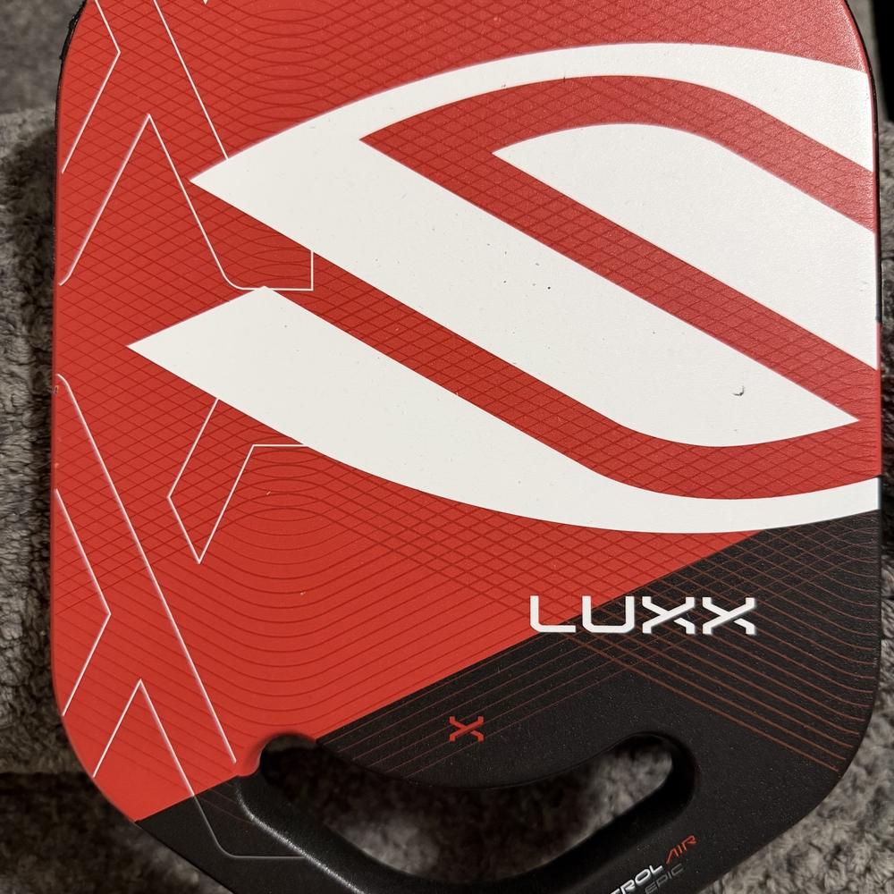 Selkirk LuxxRed and White Men’s Pickleball Paddle with Black Handle